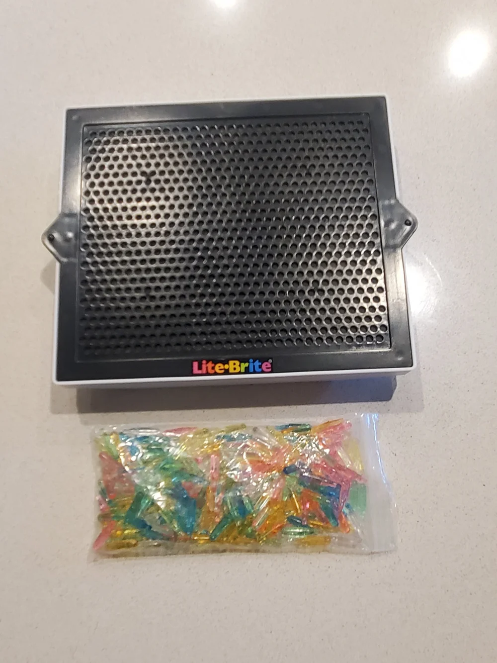 Like new, in box. Mini Lite Brite